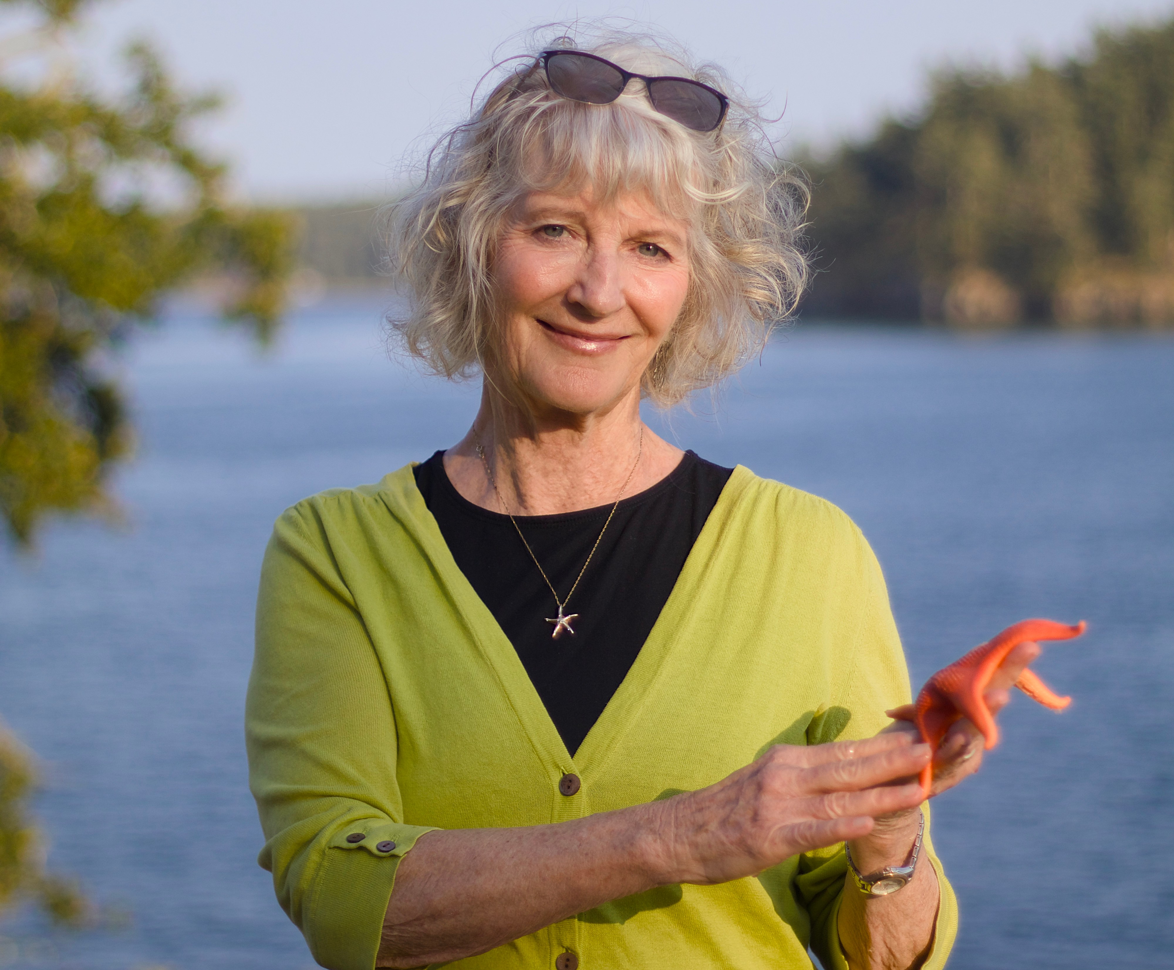Woman holding a starfish.