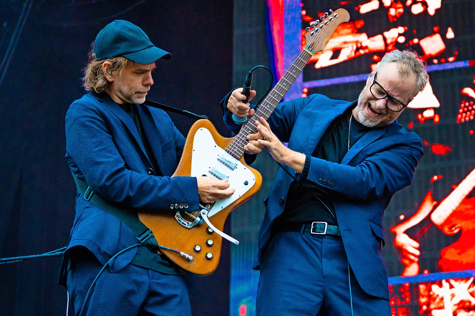 Bryce Dessner and Matt Berninger of The National performing on stage.